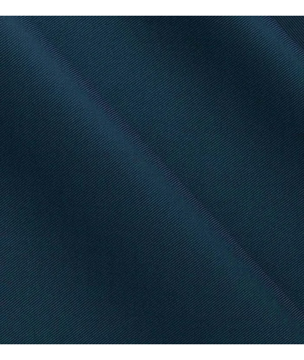 Costume mariage bleu nuit — détail tissu et finition sur mesure