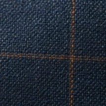 Veste bleu double carreaux marron — détail macro tissu