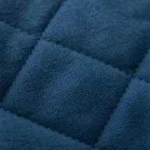 Veste matelassée bleu — détail macro tissu