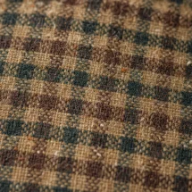 Veste marron tweed carreaux — détail macro tissu